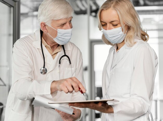 Doctors with medical masks talking