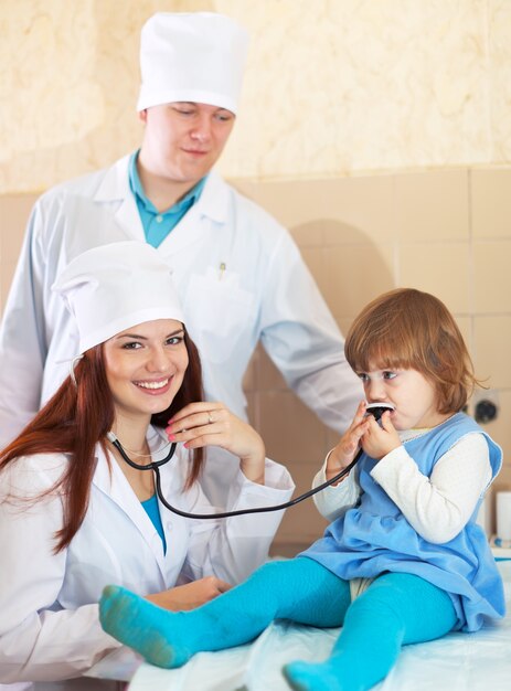 Doctors working with baby