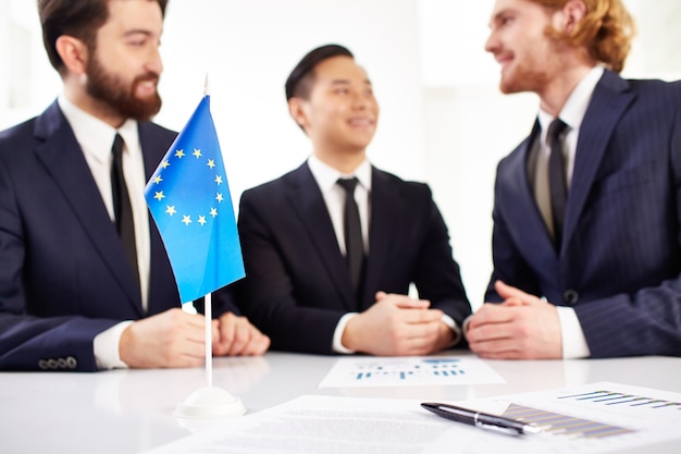 Documents and europe flag foreground