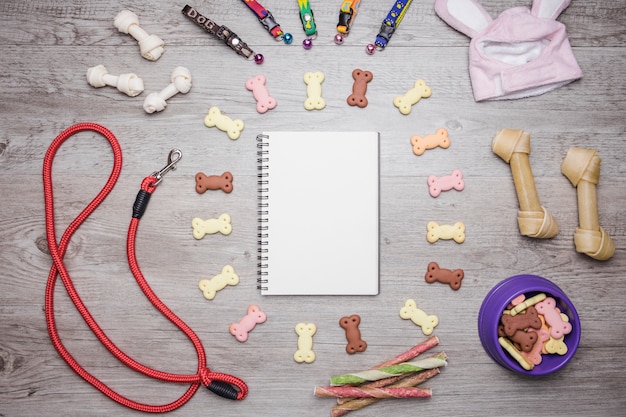 Free photo dog accessories snacks and notebook set