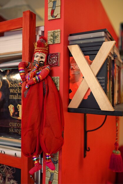 Doll hanging on a shelf