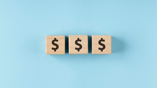 dollars on wooden cubes arrangement