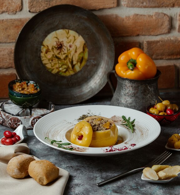 Dolma, yellow bell pepper stuffed with meat and vegetables