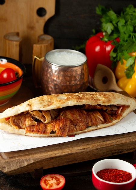 Free photo doner in bread with meat and ayran