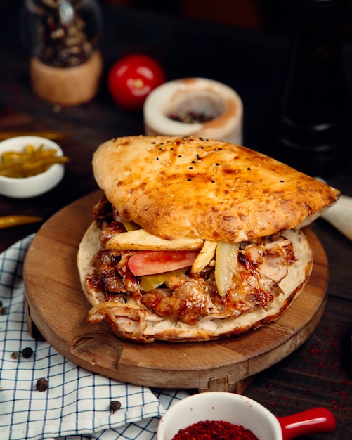 Doner with meat in a round tandoor