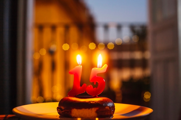 Free photo donut with lit candles