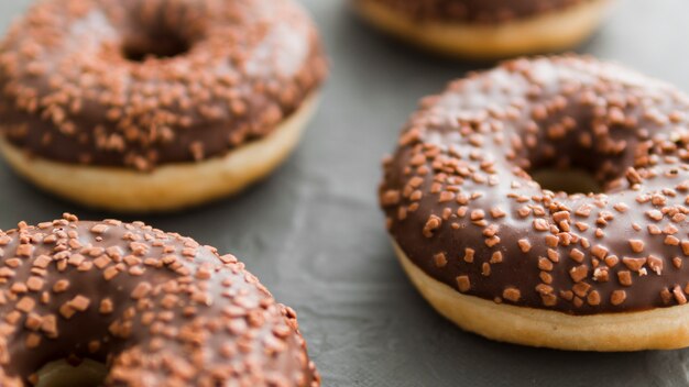 Donuts coated with chocolate and sprinkles