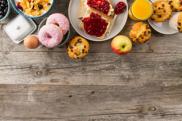 Donuts, cupcakes and apple