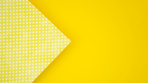 Dots on paper and yellow copy space background