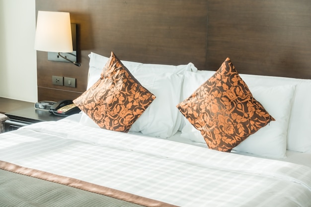 Double bed with orange cushions