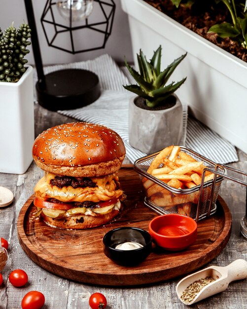 Double burger with fries and ketchup