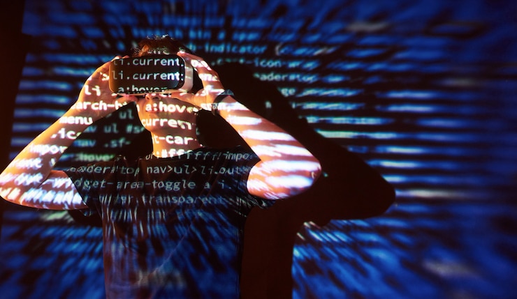 Free Photo double exposure of a caucasian man and virtual reality vr headset is presumably a gamer or a hacker cracking the code into a secure network or server, with lines of code