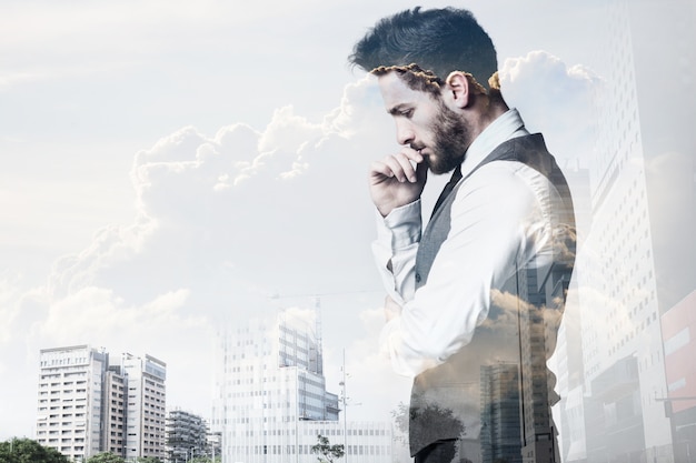 Free photo double exposure of young businessman and city.