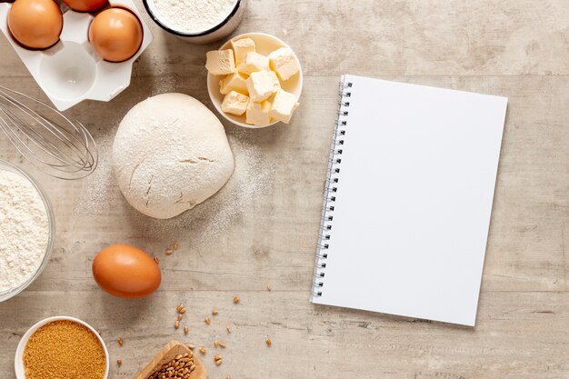 Dough ingredients and a notebook