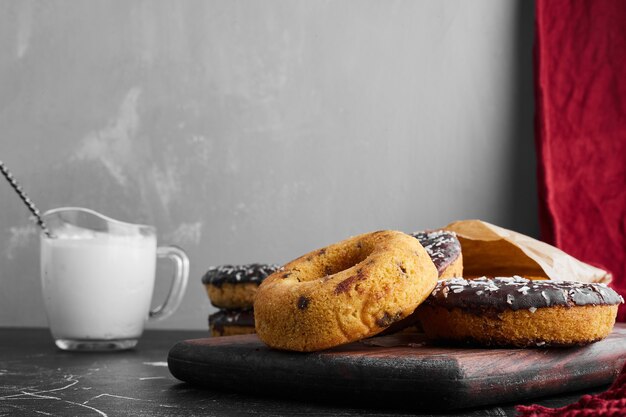 Doughnuts on a stone board with curd. 