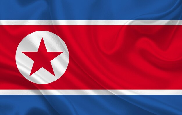 Dprk country flag on wavy silk fabric background panorama - illustration