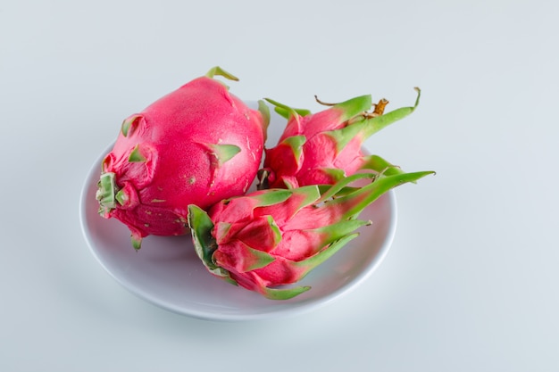 Dragon fruit in a plate, high angle view.