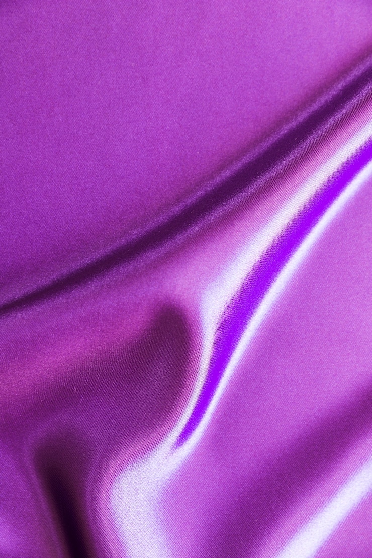 Free Photo drape of smooth purple satin background