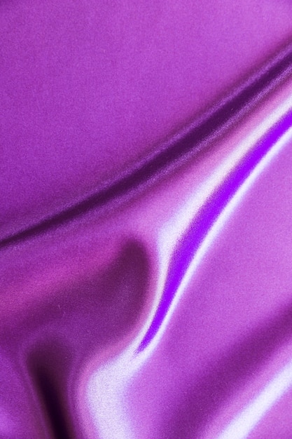 Drape of smooth purple satin background