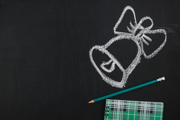 Drawing bell on blackboard