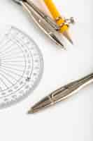 Free photo drawing figures such as metallic compass isolated with pencil on white