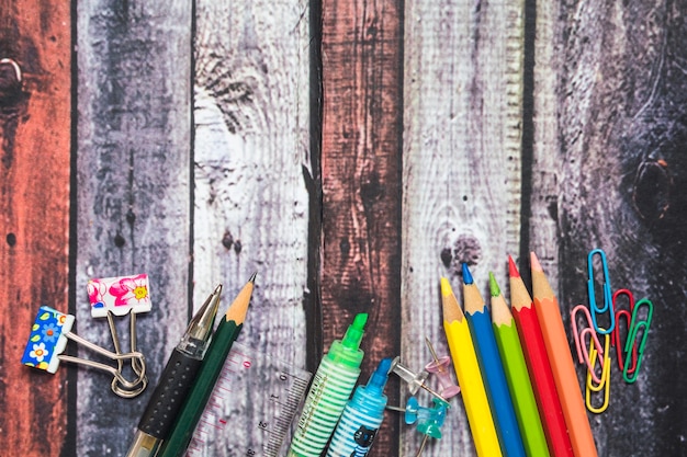 Drawing supplies on wooden background