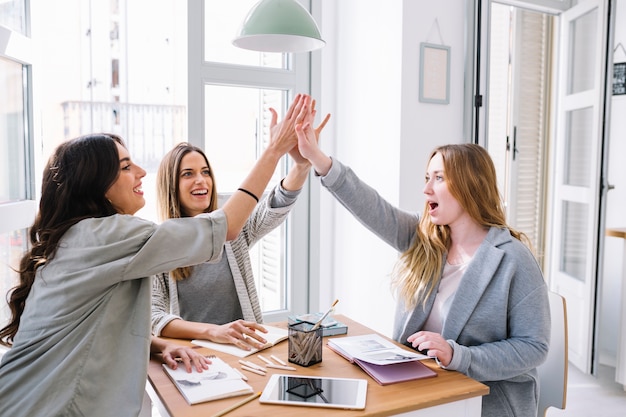 Drawing women giving high five