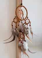 Free photo dreamcatcher hanging from a mirror