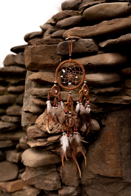 Dreamcatcher hanging from a rock