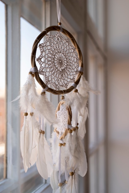 Dreamcatcher hanging in the front of the windows