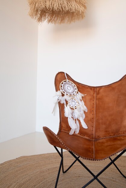 Dreamcatcher placed on the backrest of a leather chair