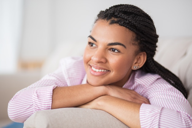 Dreamful black woman thinking of future