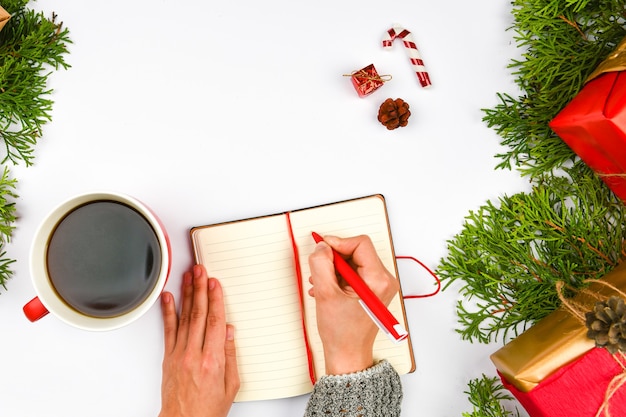 Dreams of goals plans make a list for writing new year christmas concept in notebook