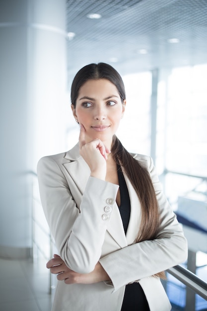 Free photo dreamy beautiful middle-aged business woman