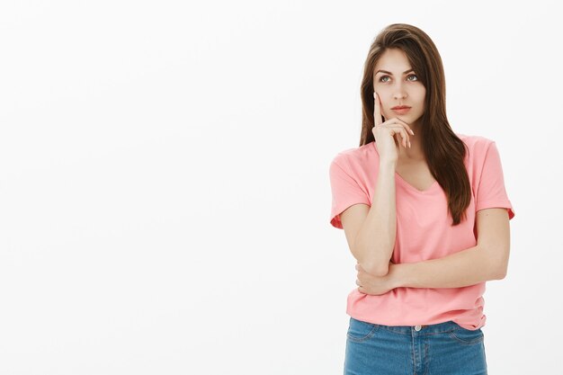 Dreamy brunette woman posing in the studio