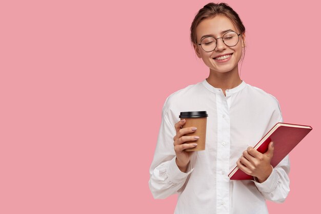 Dreamy pleased Caucasian woman with joyful expression