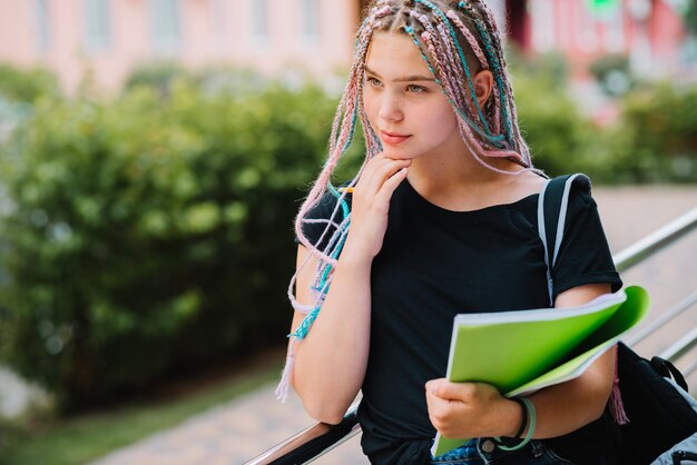 Free photo dreamy student with braids