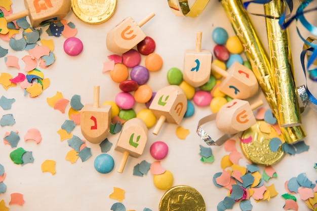 Dreidels on confetti and candies