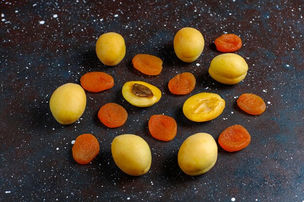 Dried apricots with fresh juicy apricot fruits,top view