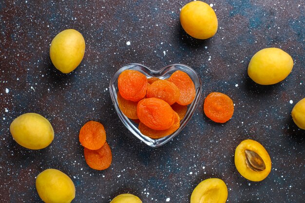 Dried apricots with fresh juicy apricot fruits,top view