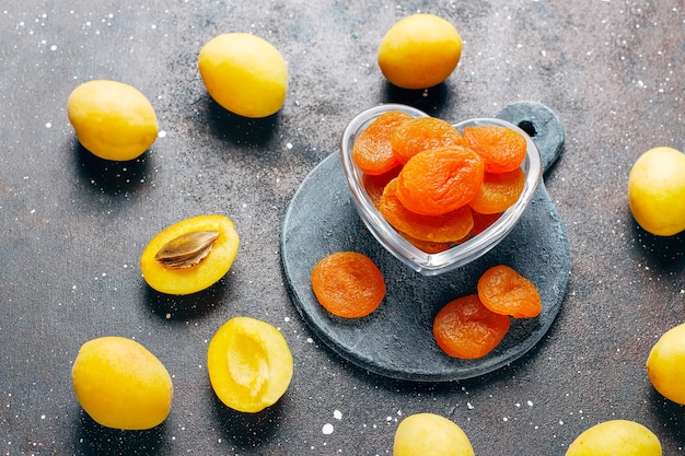 Dried apricots with fresh juicy apricot fruits,top view