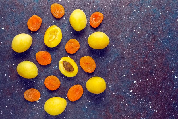 Dried apricots with fresh juicy apricot fruits,top view