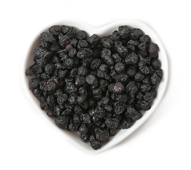 Dried blueberries in the shape of a heart isolated on 