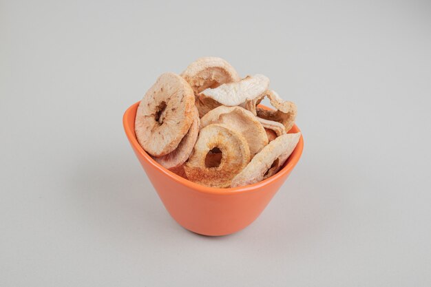 Dried fruit slices in orange bowl