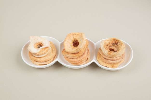 Dried fruit slices on white plate