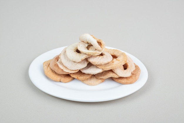 Dried fruit slices on white plate