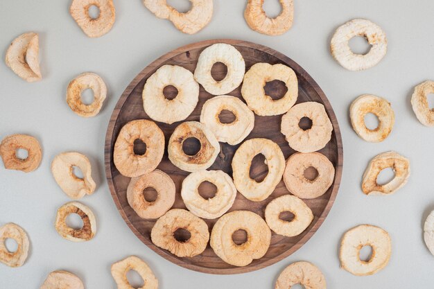 Dried healthy apple on wooden plate