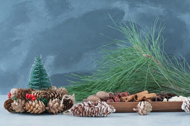 Dried healthy fruits with Christmas wreath from pinecones. High quality photo