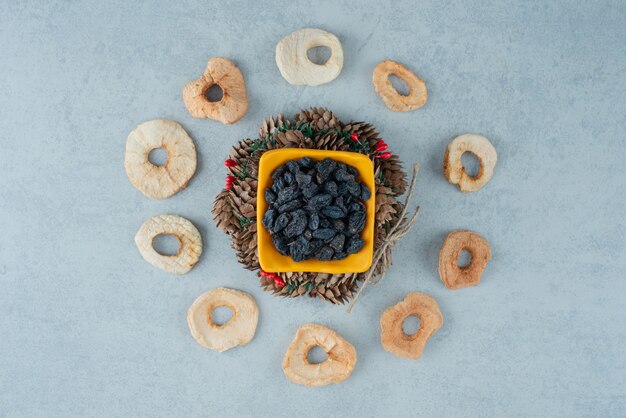 Dried healthy fruits with Christmas wreath from pinecones. High quality photo