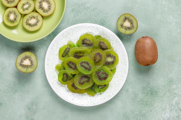 Dried homemade kiwi fruit with fresh kiwi.